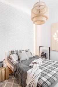 Ένα ή περισσότερα κρεβάτια σε δωμάτιο στο Apartament Biała Perła