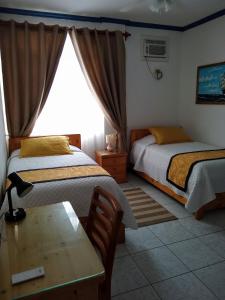 Postel nebo postele na pokoji v ubytování Drake Inn
