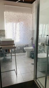 a bathroom with a tub and a toilet and a sink at Linhouse in Rome +31 photos