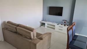 TV a/nebo společenská místnost v ubytování Praia do Forte Ibero Star- Apartamento Mediterraneo 2 Iberostate