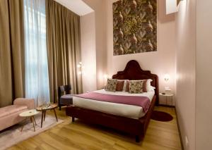 Postel nebo postele na pokoji v ubytování INTOMILAN Galleria Duomo I Boutique & Design Aparthotel + 37 fotografií