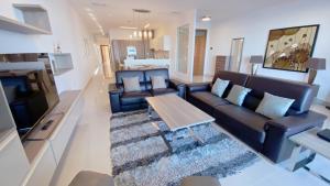 a living room with a couch and a coffee table at Quisisana Apartments - Cast Renting in Sliema