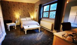 a bedroom with a bed and a window at Church View House F56H977 in Gorteen