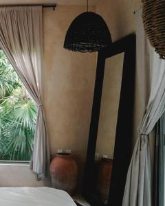 Postel nebo postele na pokoji v ubytování NEST Tulum