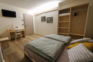 En eller flere senge i et værelse på B&B Le Ciorciole