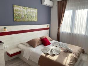 A bed or beds in a room at Apartmani Banja SPA