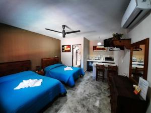 Postel nebo postele na pokoji v ubytování Holbox Isla Bonita