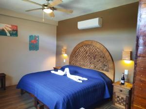 Postel nebo postele na pokoji v ubytování Holbox Isla Bonita