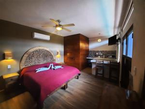 Postel nebo postele na pokoji v ubytování Holbox Isla Bonita