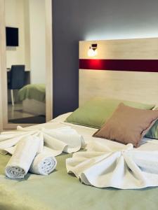 A bed or beds in a room at Apartmani Banja SPA