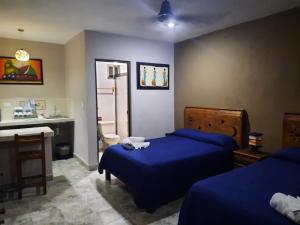 Postel nebo postele na pokoji v ubytování Holbox Isla Bonita