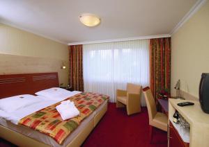 Postel nebo postele na pokoji v ubytování Garten-Hotel Ponick