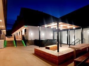 a building with stairs and a building with lights at The Alex Apartments in Queenstown