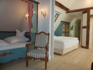 Postel nebo postele na pokoji v ubytování Boutique Hotel am Rathaus - Reblaus