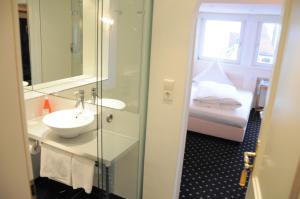 Postel nebo postele na pokoji v ubytování Boutique Hotel am Rathaus - Reblaus