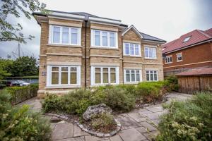 a large brick house with white windows at *ALBAN COURT *COMFY SUITE * in Hatfield