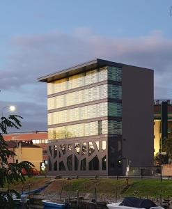 a tall building with a lot of windows at Elite Hotel & Spa in Mestre