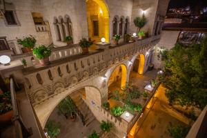 an overhead view of a building with a courtyard with plants at Stone House Cave Hotel in Goreme