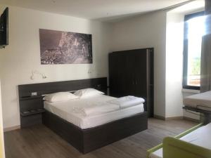 Postel nebo postele na pokoji v ubytování Antica Campione Rooms & Hostel