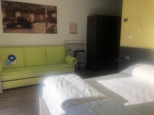 Postel nebo postele na pokoji v ubytování Antica Campione Rooms & Hostel