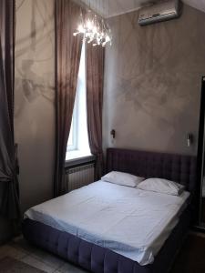 Postel nebo postele na pokoji v ubytování Opera Apart Hotel