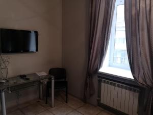 TV a/nebo společenská místnost v ubytování Opera Apart Hotel