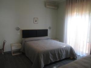 A bed or beds in a room at Hotel Prater
