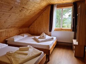 Cama o camas de una habitación en Cabana Mălina Vârtop