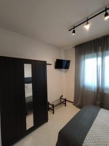 Ένα ή περισσότερα κρεβάτια σε δωμάτιο στο De Dominici's House