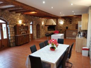 a kitchen and dining room with a table and chairs at Villa Rustica in Buje