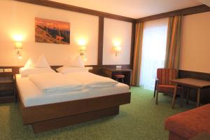 Letto o letti in una camera di Hotel Stockerwirt