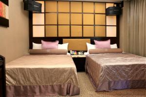 In-stone Motel 객실 침대