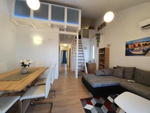 a living room with a couch and a table at Apartment Golden Sun in Vir