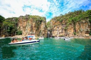 a group of people on a boat in the water at Casa LuPi in Carmo do Rio Claro