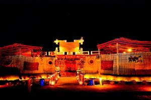a large building is lit up at night at Nuweiba Club Resort in Nuweiba
