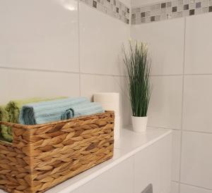 a basket of towels on a shelf in a bathroom at Apartment Golden Sun in Vir +37 photos
