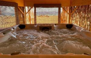 a large bath tub filled with water in a room at Nuweiba Club Resort in Nuweiba