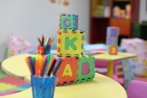 a toy block cake on a table in a classroom at Nuweiba Club Resort in Nuweiba