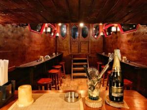 a bar with a bottle of wine on a table at Nuweiba Club Resort in Nuweiba