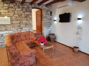 a living room with a couch and a table at Villa Rustica in Buje