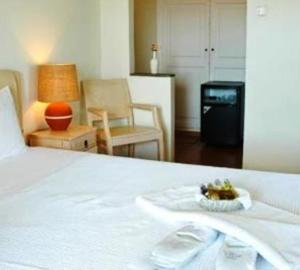 Postel nebo postele na pokoji v ubytování Petali Village Hotel