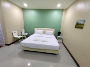 Vuode tai vuoteita majoituspaikassa SK Resort Pattaya
