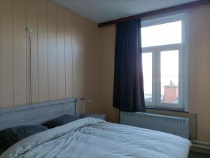 מיטה או מיטות בחדר ב-Moodraz vakantiehuis centrum Peer