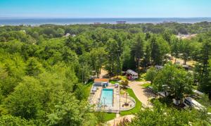 an overhead view of a resort with a swimming pool and trees at Sun Outdoors Old Orchard Beach Downtown in Old Orchard Beach