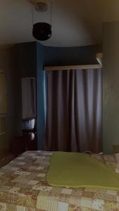 Postel nebo postele na pokoji v ubytování Los Cuartos Man Pretinha + 9 fotografií