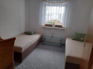 Un pat sau paturi într-o cameră la FW Thormann
