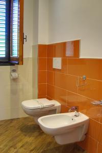 a bathroom with a toilet and a sink at Casa Pendola in Agerola