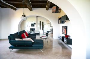 a living room with a couch and a table at canonica 43 in Colle di Val d'Elsa