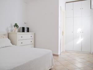 Posteľ alebo postele v izbe v ubytovaní Olive Bay Beach House Ammouliani