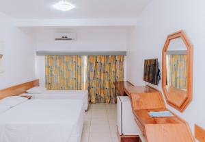 
Cama ou camas em um quarto em Poty Praia Hotel
